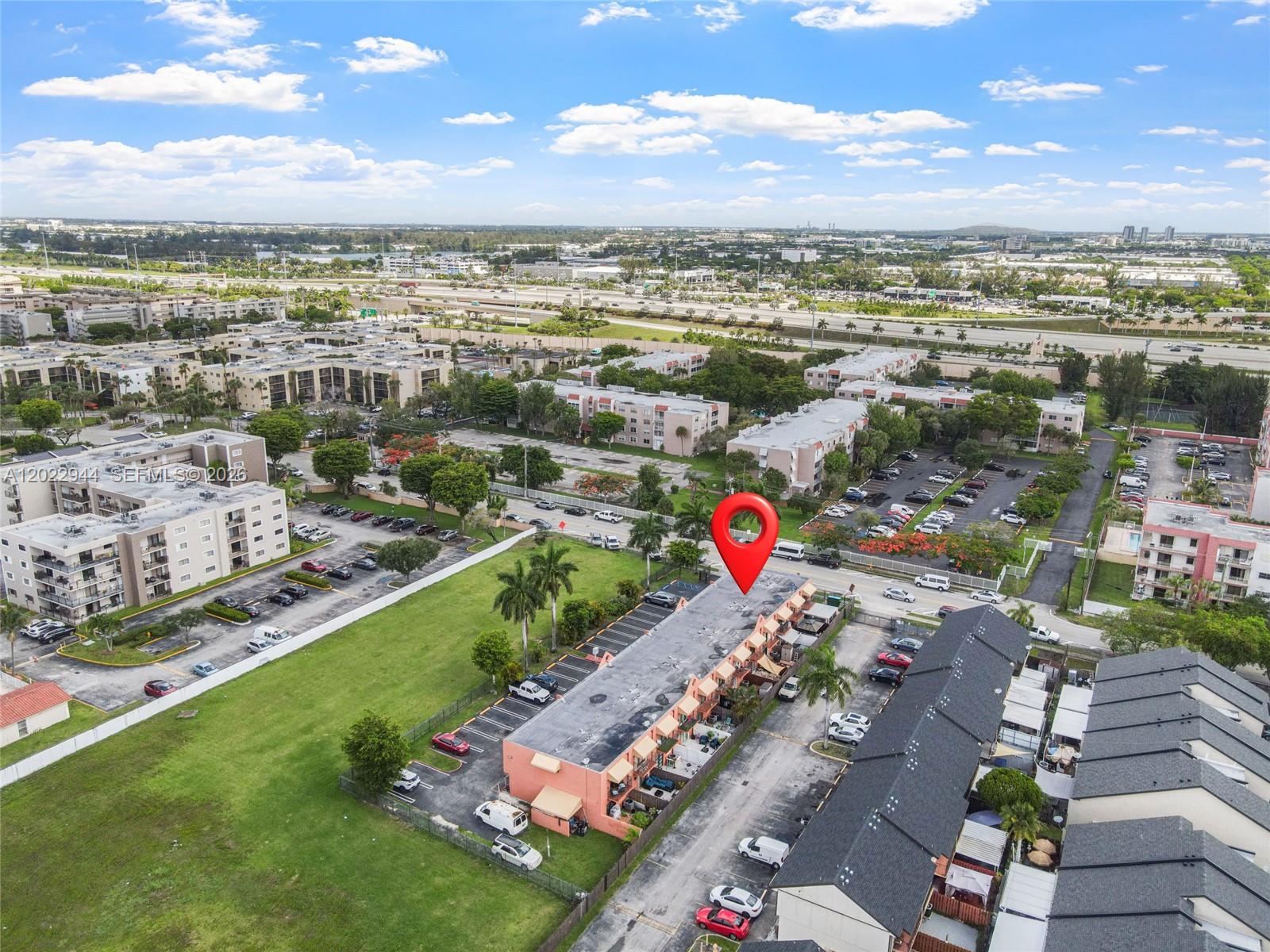 An aerial view shows a multi-unit residential building with a red pin marker — 8454 NW 8th St # 2, Miami FL 33126, MIAMI, FL