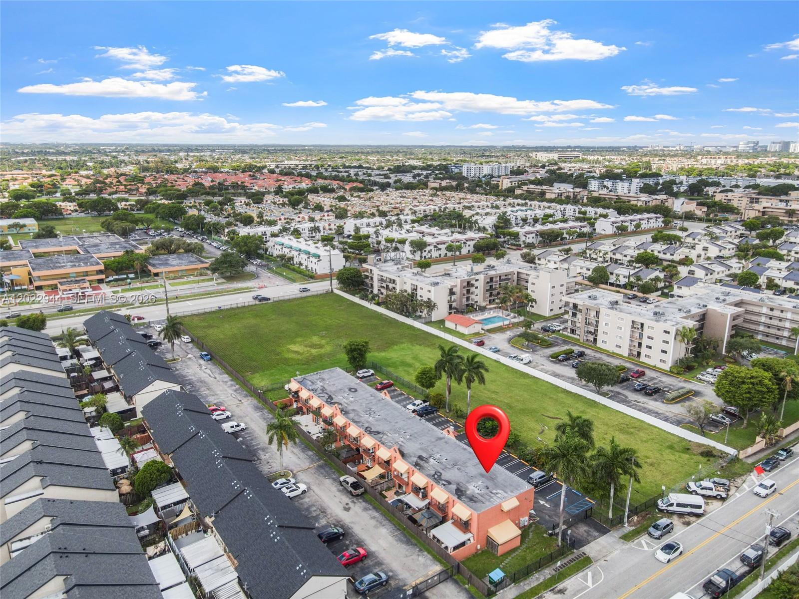 An aerial view shows a multi-unit residential building with a red location pin — 8454 NW 8th St # 2, Miami FL 33126, MIAMI, FL