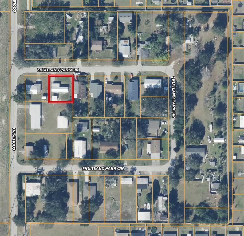 This is an aerial map showing a residential property highlighted in red — 1821 FRUITLAND PARK CIRCLE, EAGLE LAKE, FL
