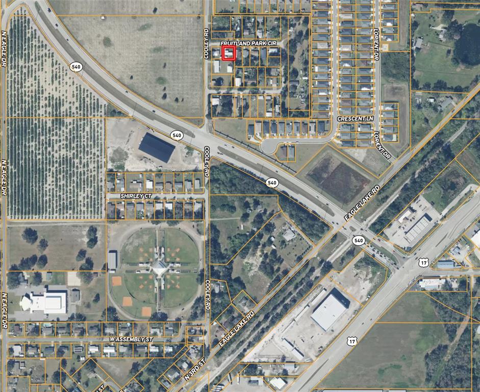 This is an aerial map showing a residential property highlighted in red near major roads — 1821 FRUITLAND PARK CIRCLE, EAGLE LAKE, FL