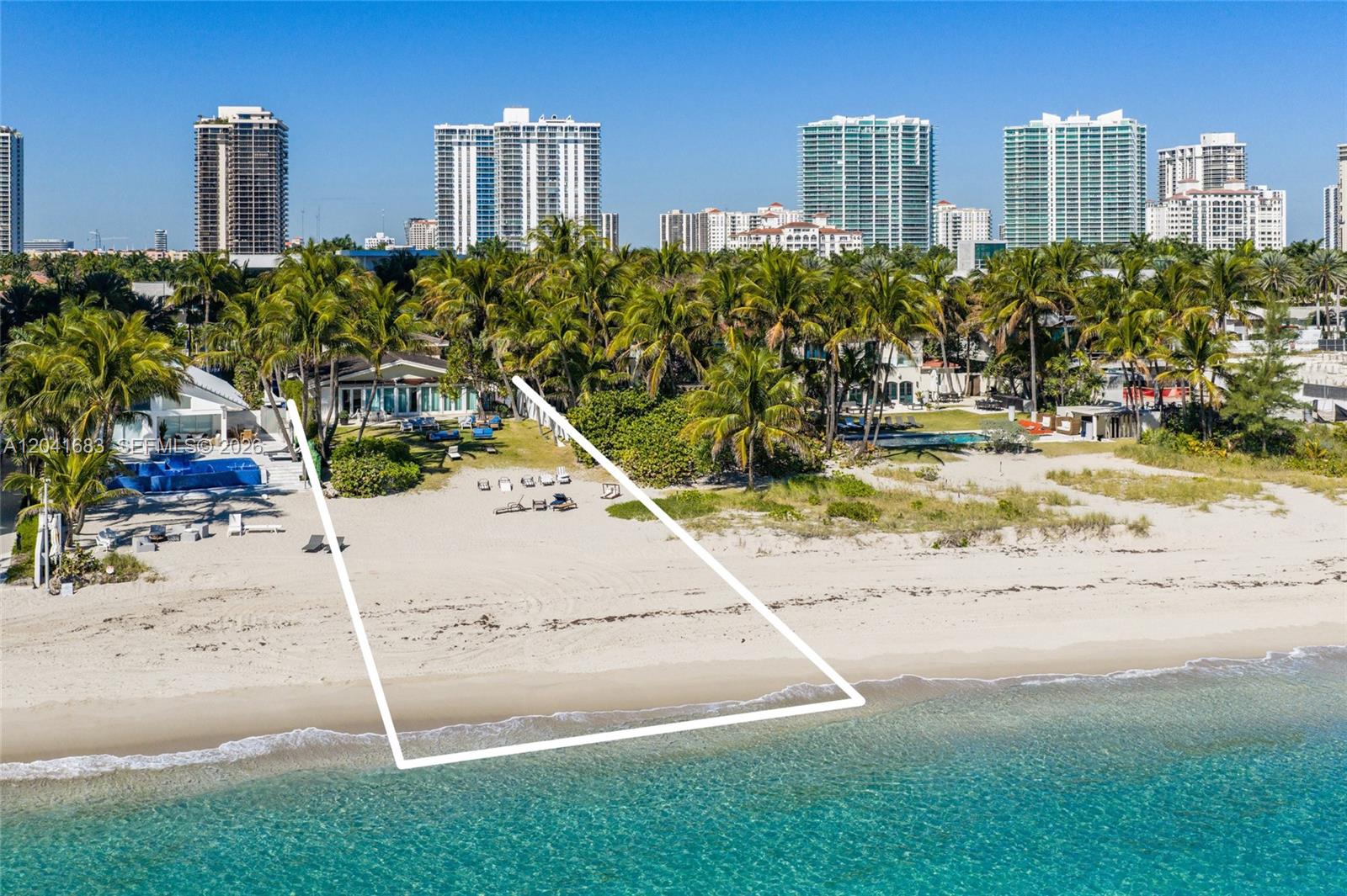 An aerial view shows a beachfront property with a white outline marking the lot boundaries — 105 Ocean Blvd, Golden Beach FL 33160, GOLDEN BEACH, FL