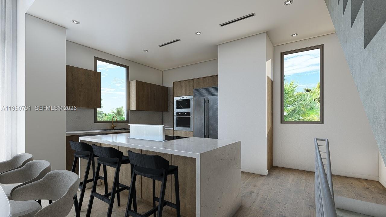 This rendering shows a modern kitchen with a central island, wood cabinetry, and stainless appliances — 800 84th St, Miami Beach FL 33141, MIAMI BEACH, FL
