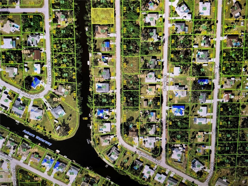 This is an aerial map showing residential lots, streets, and a waterway — 2267 CANNOLOT BOULEVARD, PORT CHARLOTTE, FL