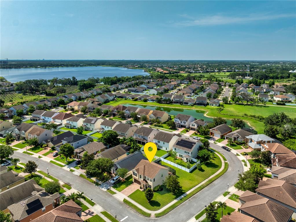 An aerial view shows a two-story suburban house with a yellow location pin — 15058 SAWGRASS BLUFF DRIVE, WINTER GARDEN, FL