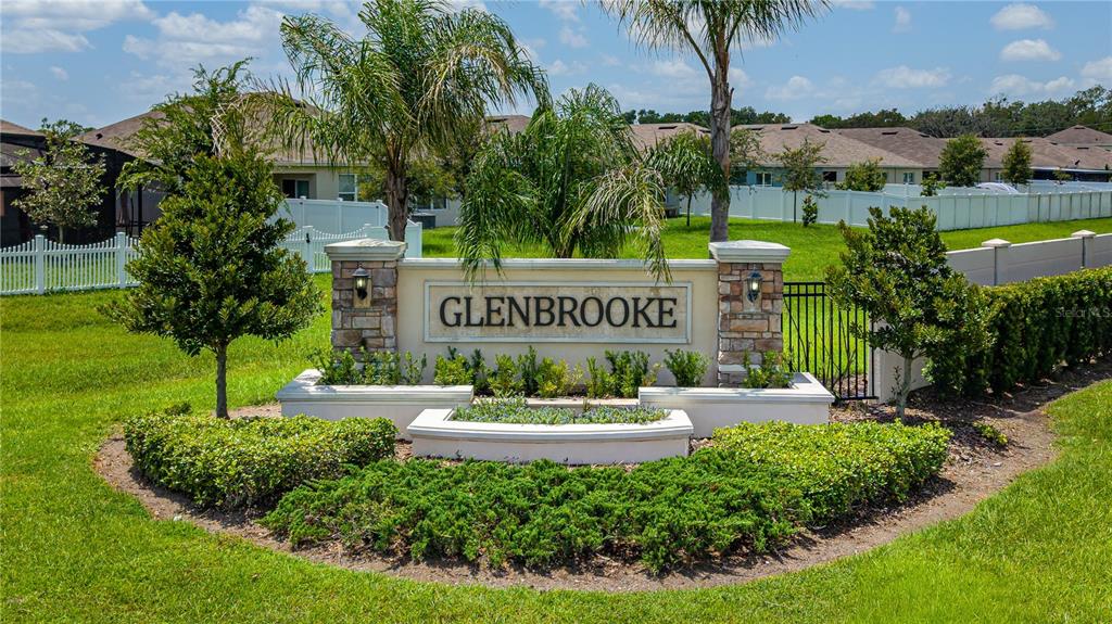 A stone monument sign for the Glenbrooke community sits in a landscaped lawn — 2731 FIELDBROOKE WAY, EDGEWATER, FL