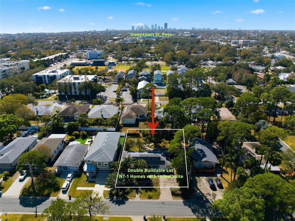 An aerial view shows a residential lot with a house and surrounding neighborhood — 208 48TH AVENUE N, ST PETERSBURG, FL