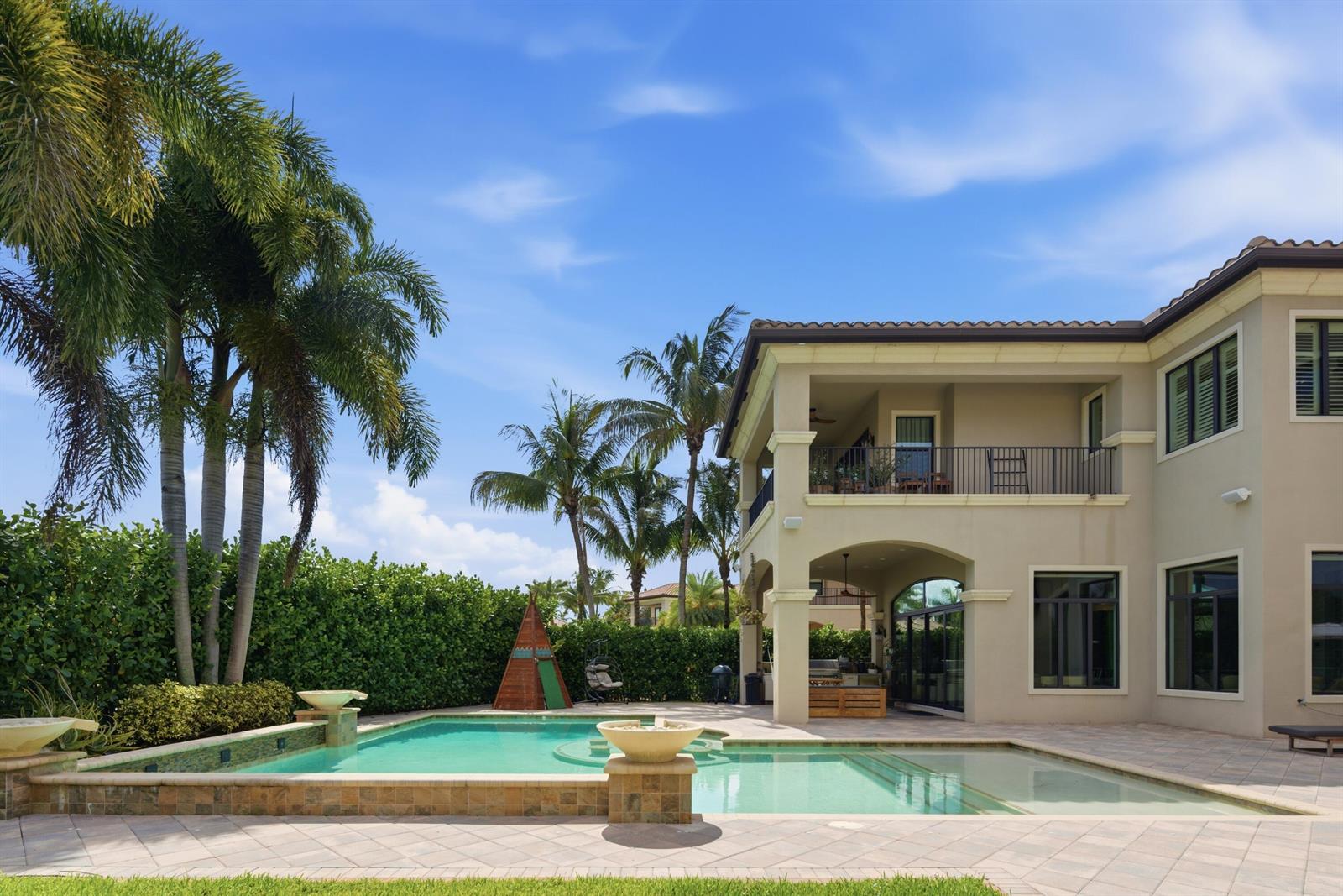 A two-story house with a backyard swimming pool, patio, and palm trees — 16907 Crown Bridge Drive, Delray Beach FL 33446, DELRAY BEACH, FL