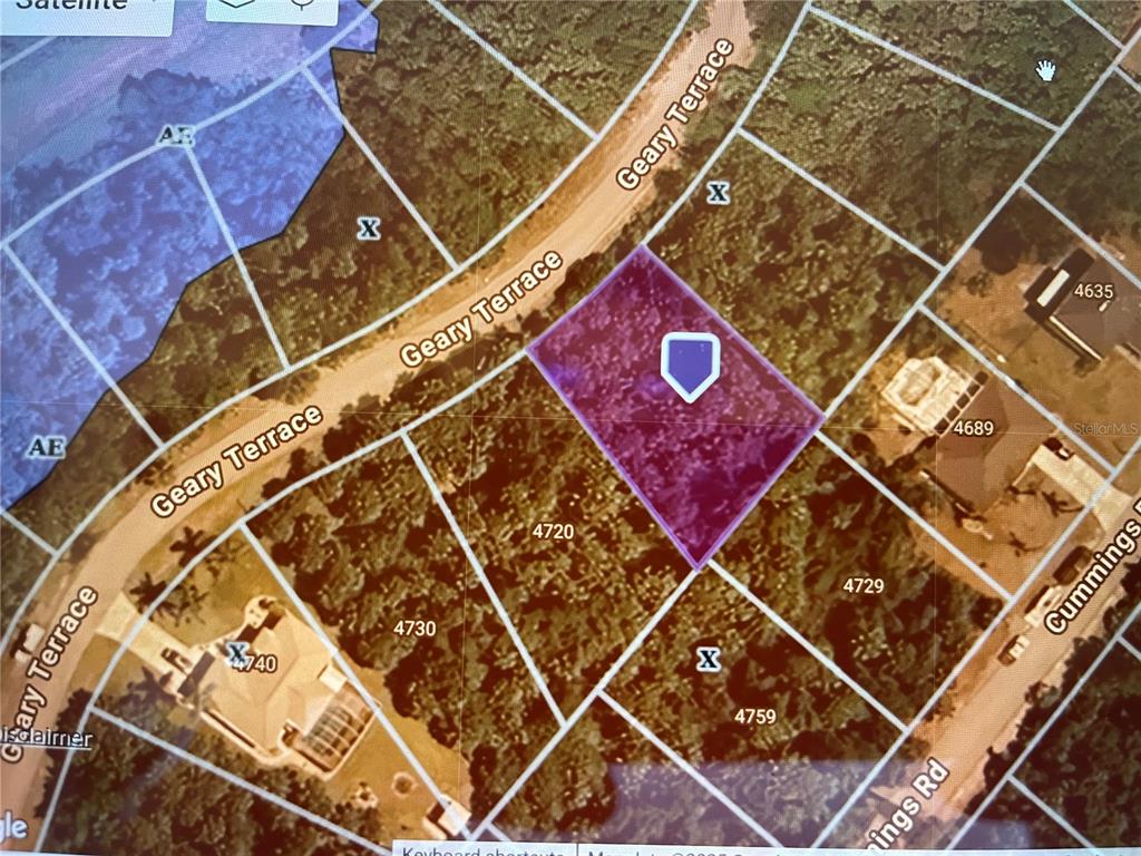 This is a satellite map view showing a highlighted vacant lot bordered by residential streets — GEARY TERRACE N, NORTH PORT, FL