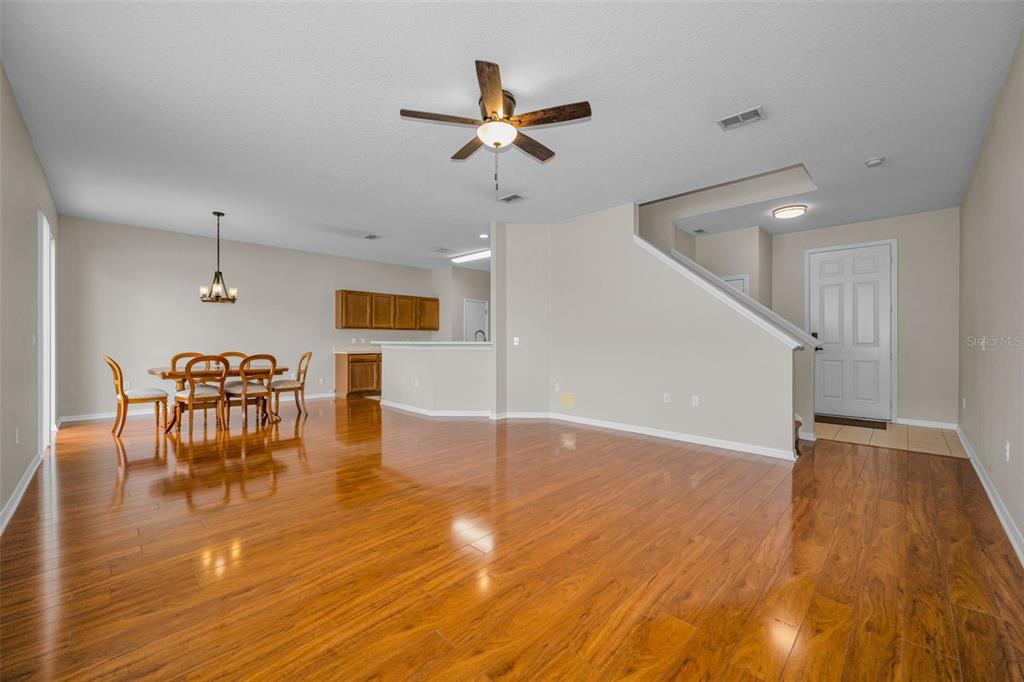 A kitchen features wood cabinets, stainless steel appliances, and tile flooring — 17539 BALMAHA DRIVE, LAND O LAKES, FL