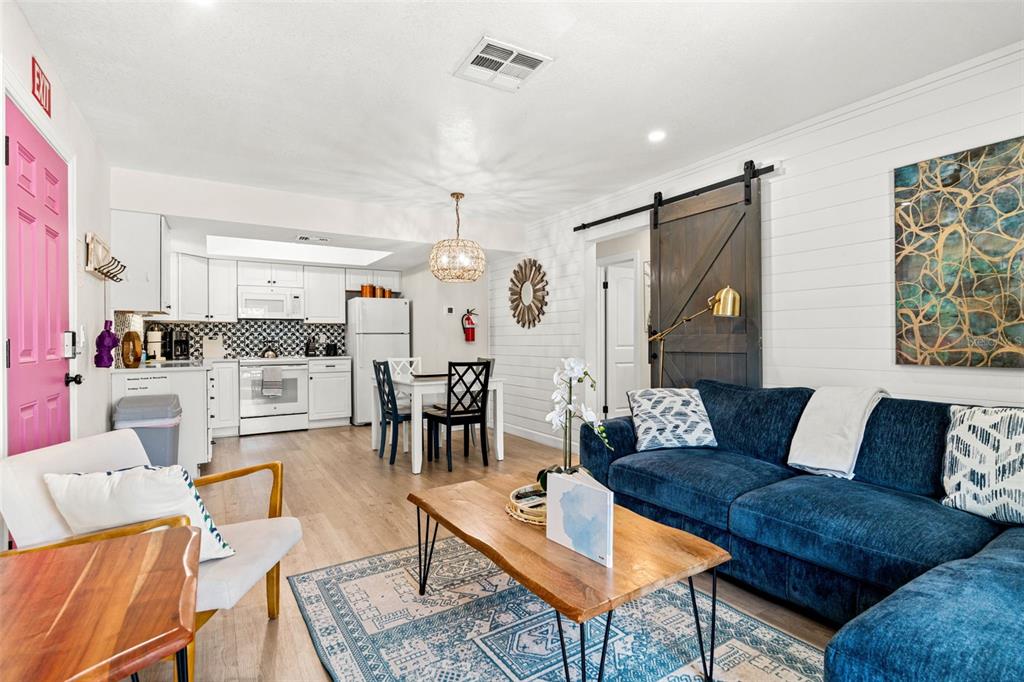 An aerial view shows a coastal neighborhood with a highlighted property near the beach — 8106 GULF DRIVE UNIT A&B, HOLMES BEACH, FL