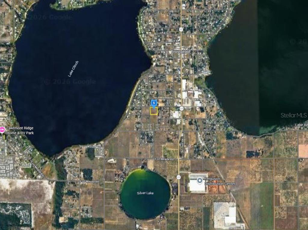 This is a satellite map view showing a property lot highlighted in yellow near Frostproof — 151 W 7TH STREET, FROSTPROOF, FL
