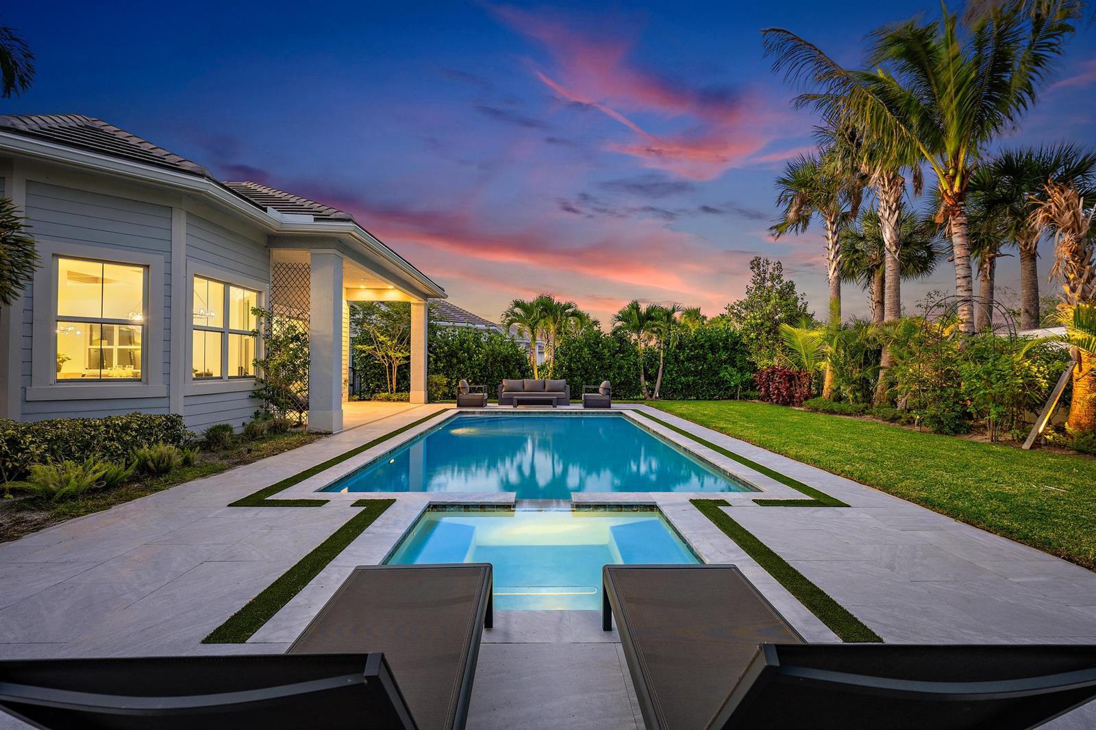 A backyard swimming pool and hot tub with lounge chairs and a covered patio area — 9338 Crestview Circle, Palm Beach Gardens FL 33412, PALM BEACH GARDENS, FL