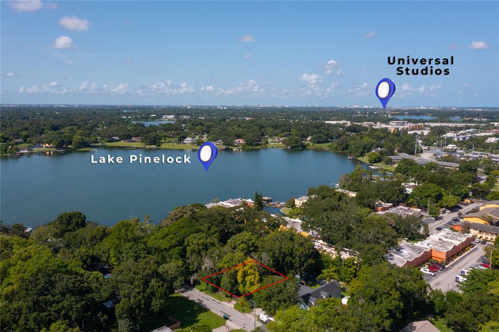 This aerial view shows a vacant lot outlined in red near Lake Pinelock and Universal Studios — 2812 KEYSTONE DRIVE Lot 17 & 18, ORLANDO, FL