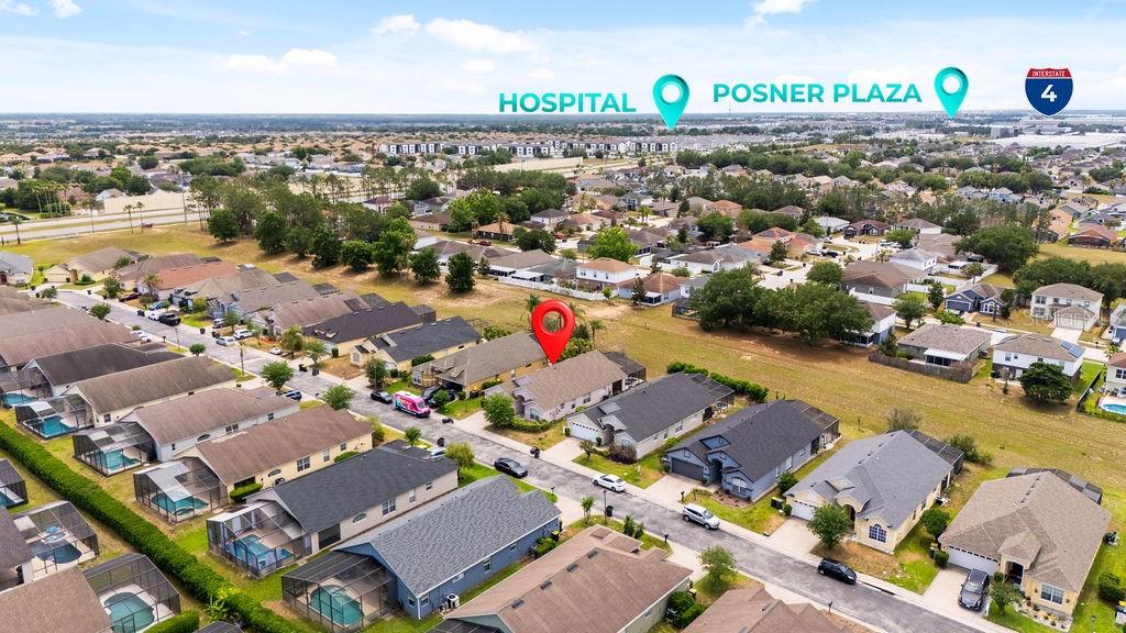 An aerial view shows a suburban neighborhood with a red pin marking a specific house — 620 OLD BRIDGE CIRCLE, DAVENPORT, FL