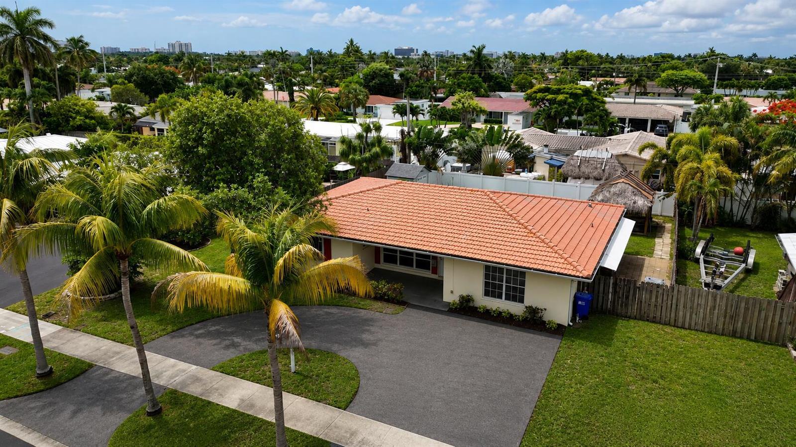 An aerial view shows a single-story house with a terracotta tile roof and paved driveway — 420 SE 4th Court, Pompano Beach FL 33060, POMPANO BEACH, FL