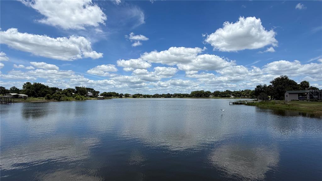 A view of a calm lake under a blue sky with scattered white clouds — 0 LAKEVIEW STREET, UMATILLA, FL