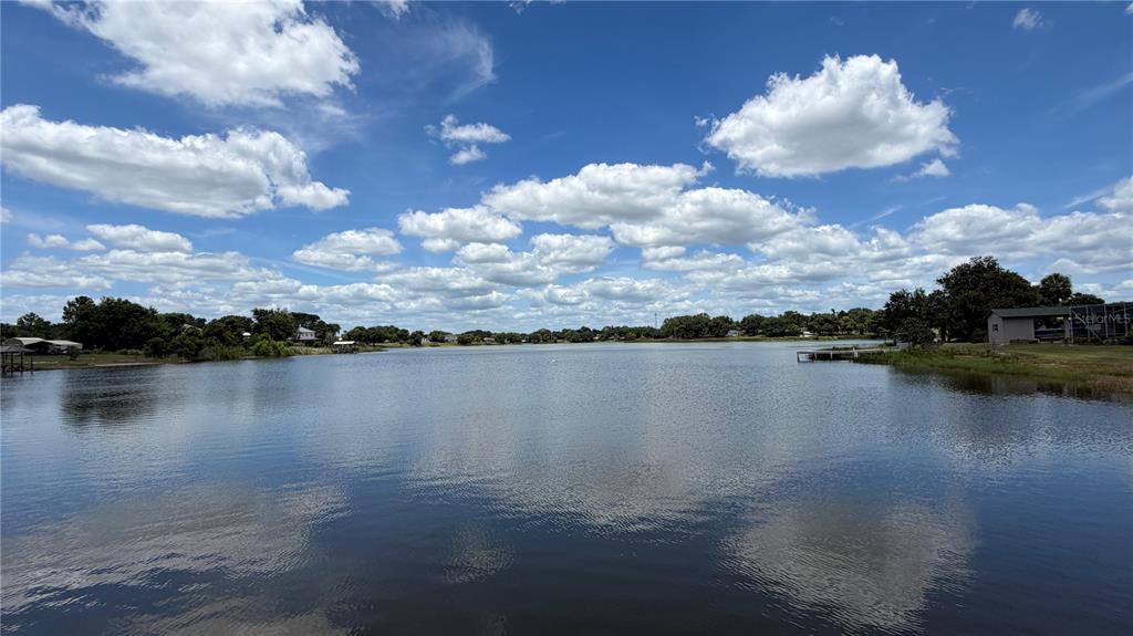 A view of a calm lake under a bright blue sky with scattered clouds — 0 LAKEVIEW STREET, UMATILLA, FL