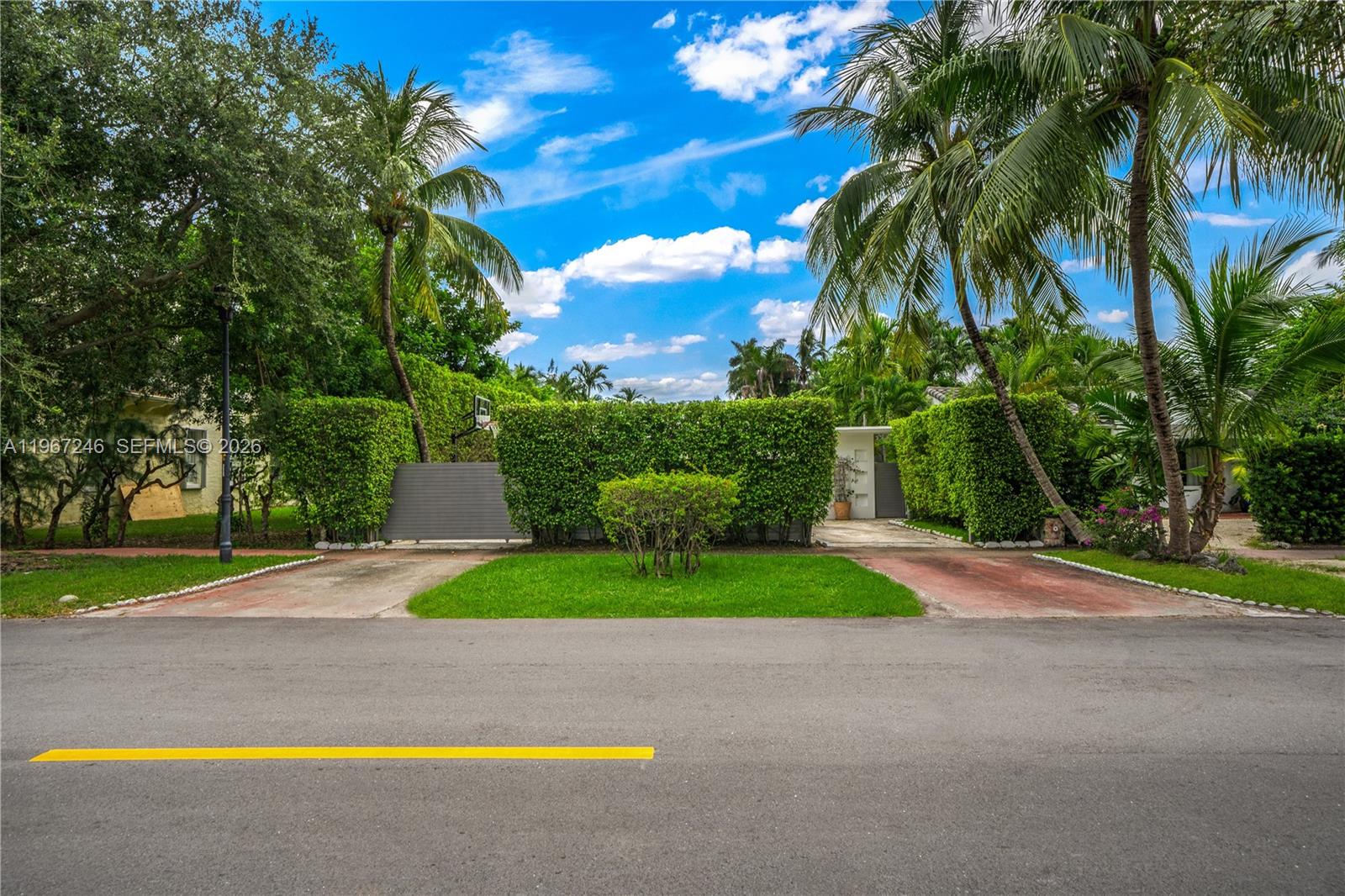 A backyard features a swimming pool, a covered patio with seating, and a grill — 736 W 51 st, Miami Beach FL 33140, MIAMI BEACH, FL