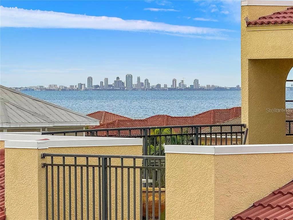 A view of a city skyline across a body of water from a balcony — 6418 MARGARITA SHORES LANE, APOLLO BEACH, FL