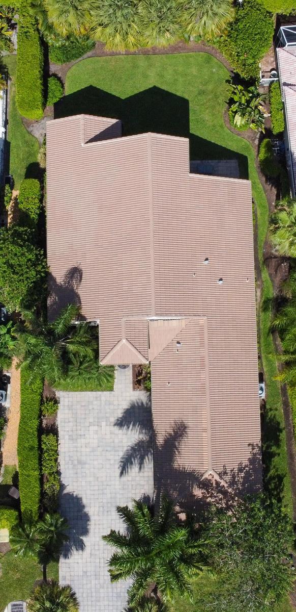 An aerial view shows the tiled roof of a house surrounded by trees and landscaping — 8197 Cypress Point Road, West Palm Beach FL 33412, WEST PALM BEACH, FL