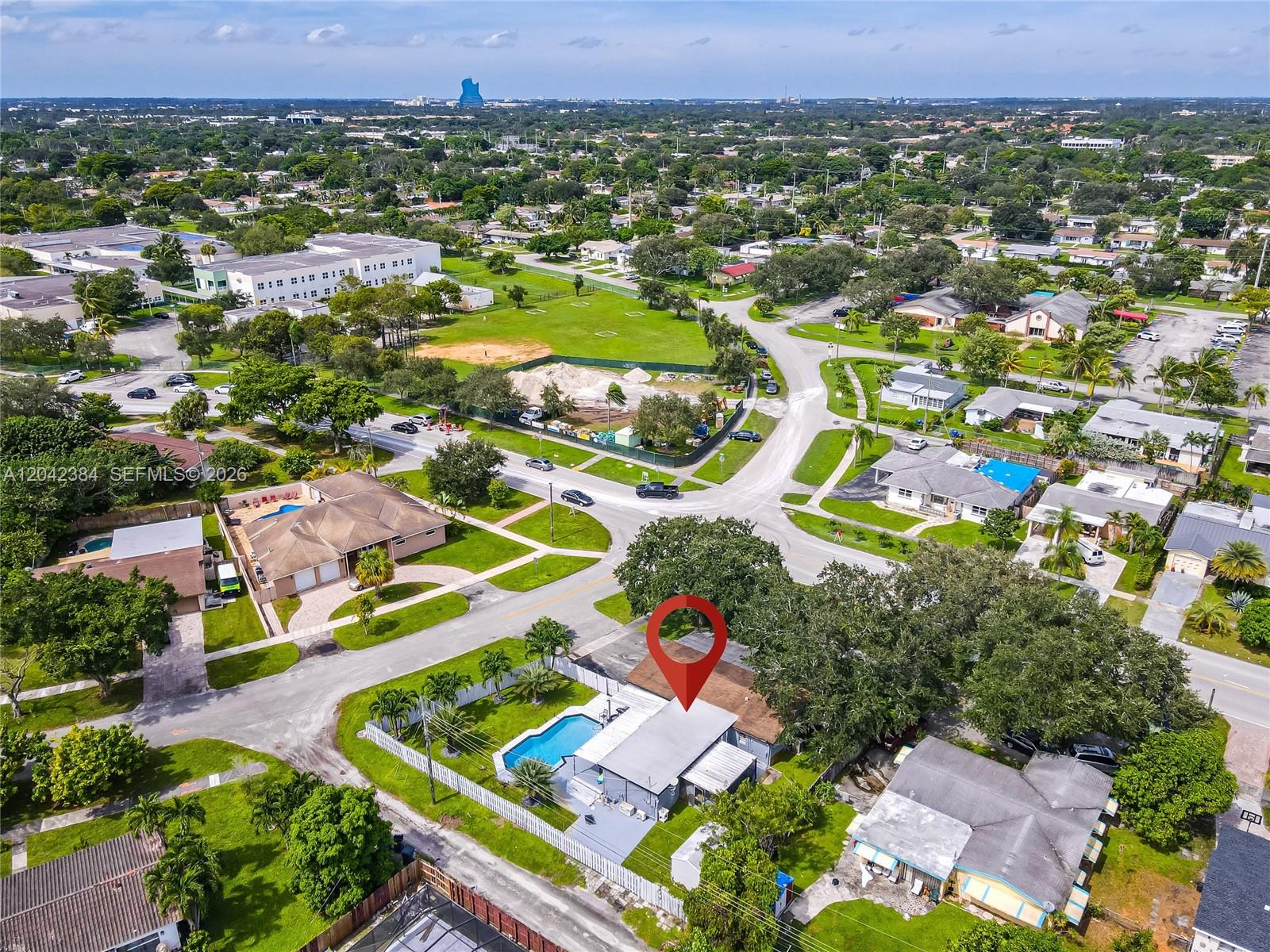 An aerial view shows a residential house with a swimming pool and a red pin — 3338 Taft St, Hollywood FL 33021, HOLLYWOOD, FL