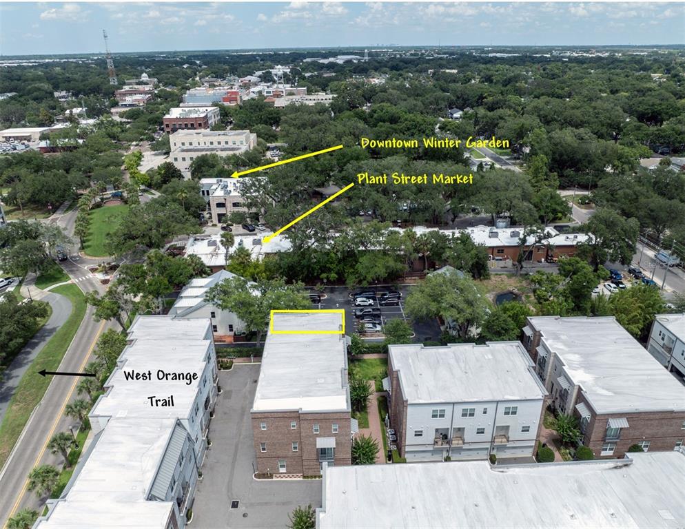 This aerial view shows a residential complex near the West Orange Trail and downtown area — 461 GERANIUM PARK WAY, WINTER GARDEN, FL