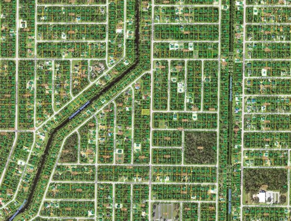 This is a map showing a residential neighborhood grid with streets and individual land parcels — 243 WARRINGTON BOULEVARD, PORT CHARLOTTE, FL