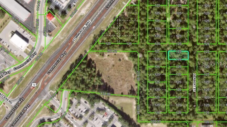 This is a map showing a vacant lot highlighted in blue among wooded residential parcels — Lot 2 GERBERT STREET, SPRING HILL, FL