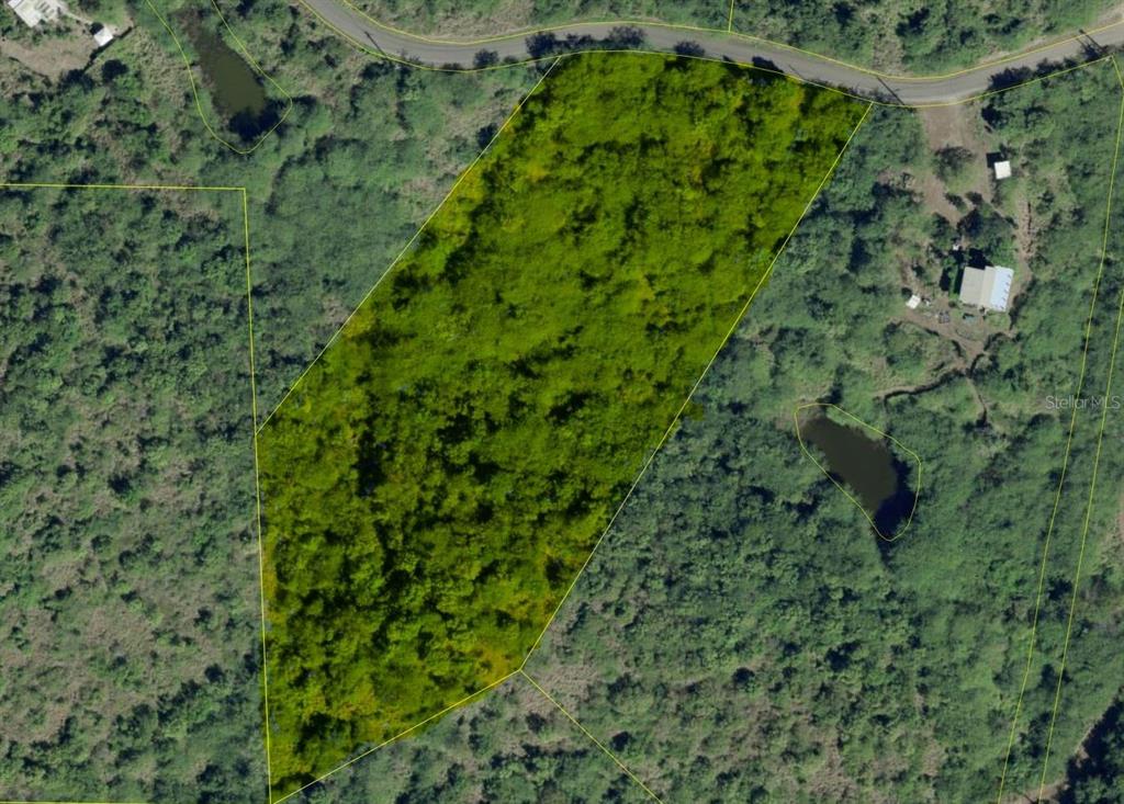 An aerial view shows a plot of land highlighted in green surrounded by dense vegetation — 10 SOUTHEAST HARBOUR ESTATES, CULEBRA, PR