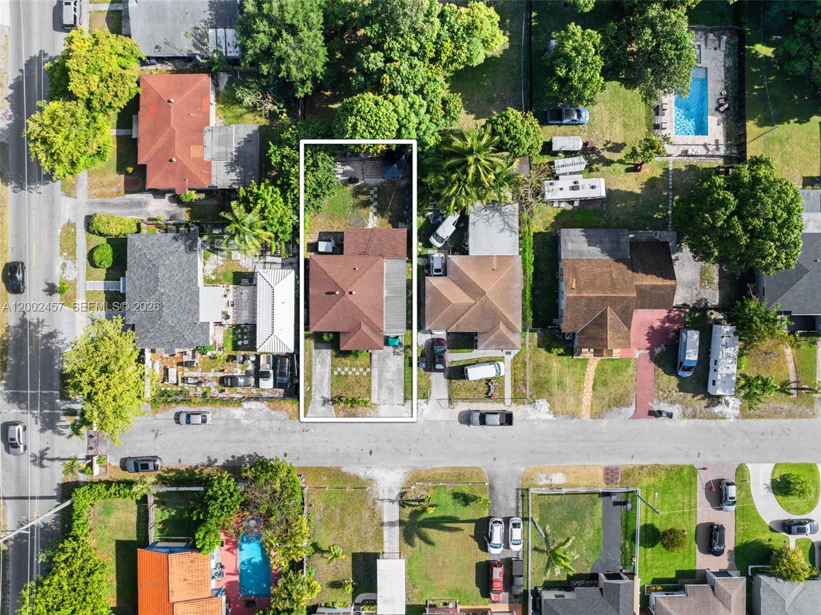 An aerial view shows a residential property with a brown roof and driveway — 2410 Jackson St, Hollywood FL 33020, HOLLYWOOD, FL
