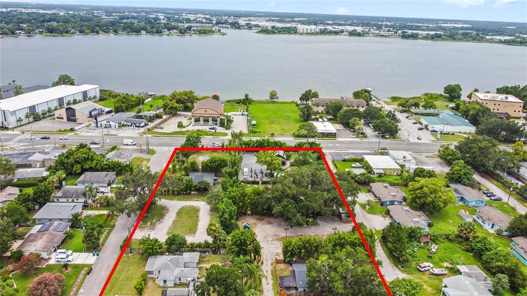 An aerial view shows a rectangular property lot outlined in red near a large lake — 4421 EDGEWATER DRIVE, ORLANDO, FL
