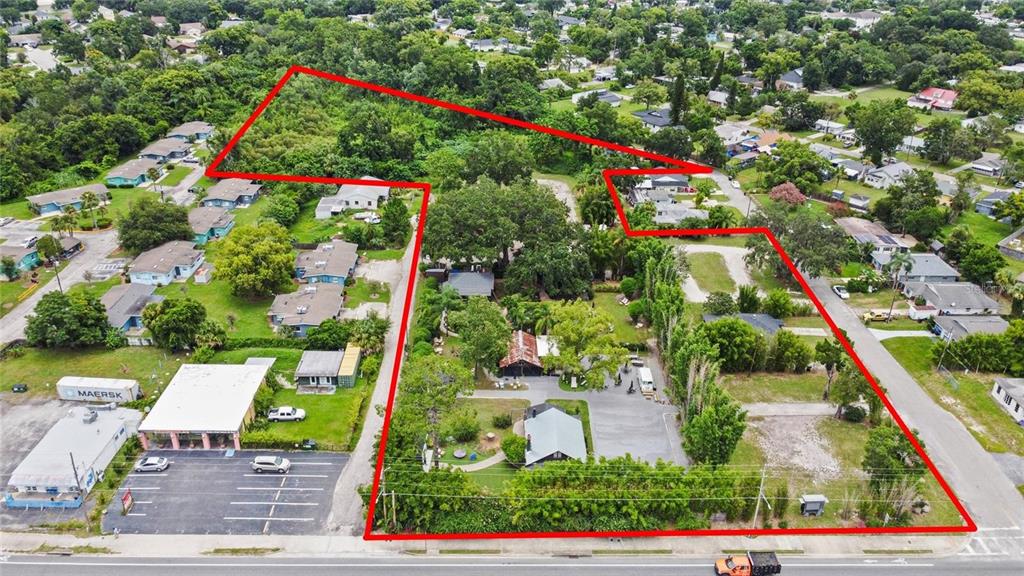 An aerial view shows a large, irregularly shaped lot outlined in red containing several buildings — 4421 EDGEWATER DRIVE, ORLANDO, FL