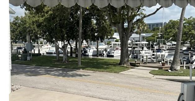 A view of a marina with several boats docked along a grassy waterfront area — 206 Eagle Drive E, Briny Breezes FL 33435, BRINY BREEZES, FL