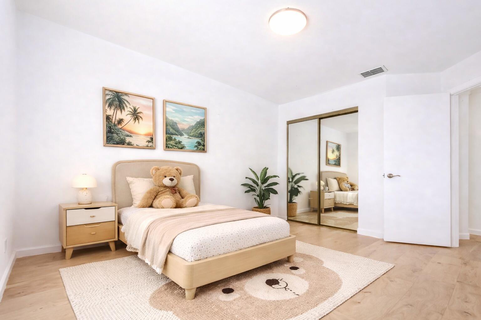A bedroom features a single bed, a nightstand, a bear-shaped rug, and mirrored closet doors — 6698 Via  Regina, Boca Raton FL 33433, BOCA RATON, FL
