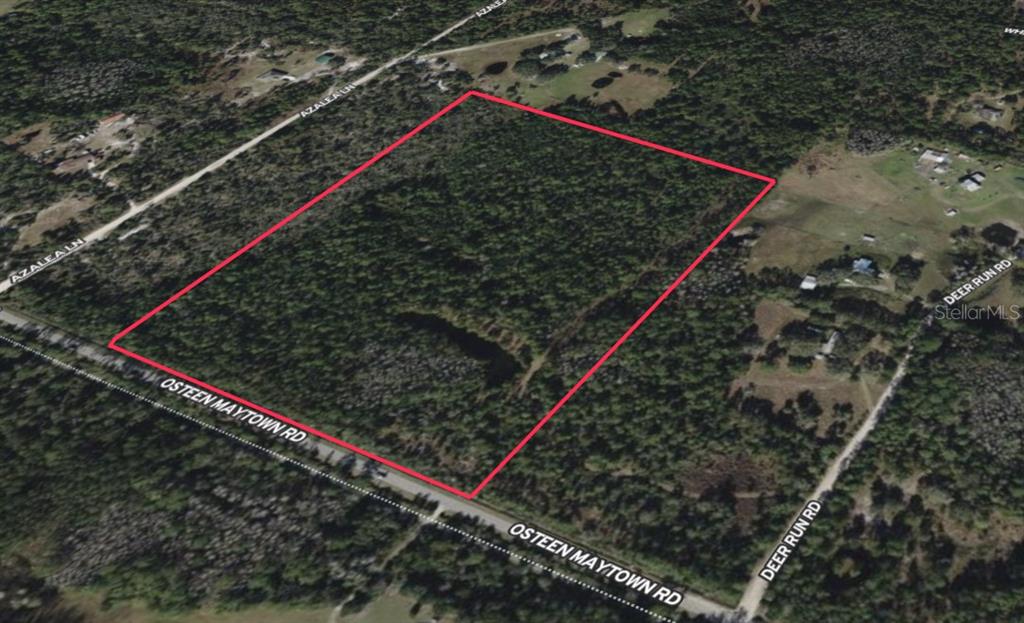 An aerial view shows a large, rectangular wooded lot outlined in red near road intersections — 0 OSTEEN MAYTOWN ROAD, OSTEEN, FL