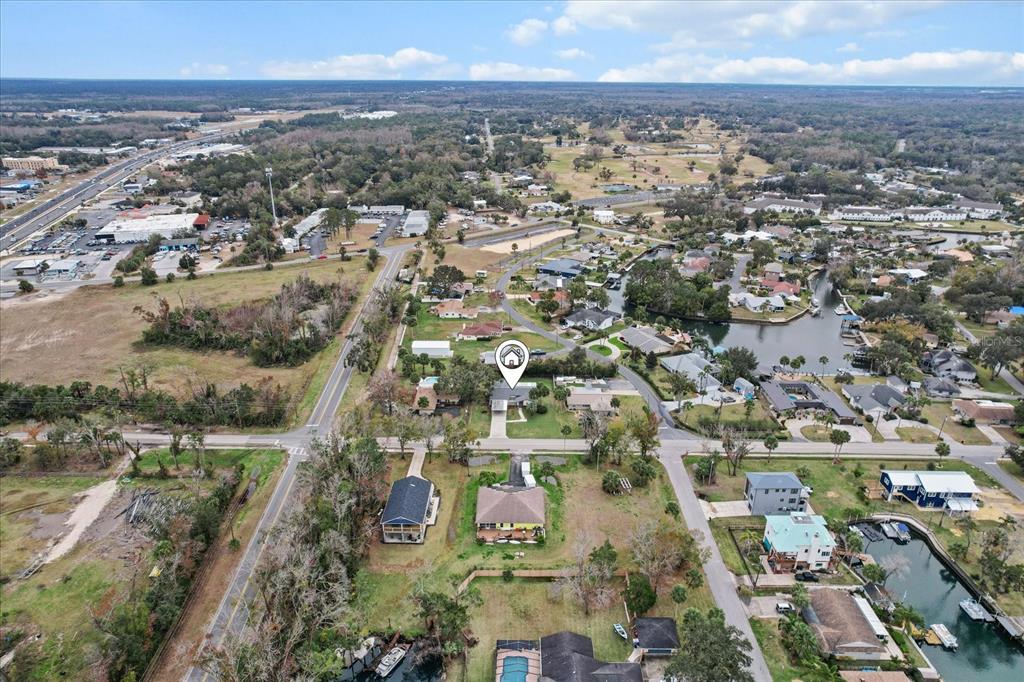 An aerial view shows a residential neighborhood with a house marked by a location pin — 512 PARADISE POINT, CRYSTAL RIVER, FL