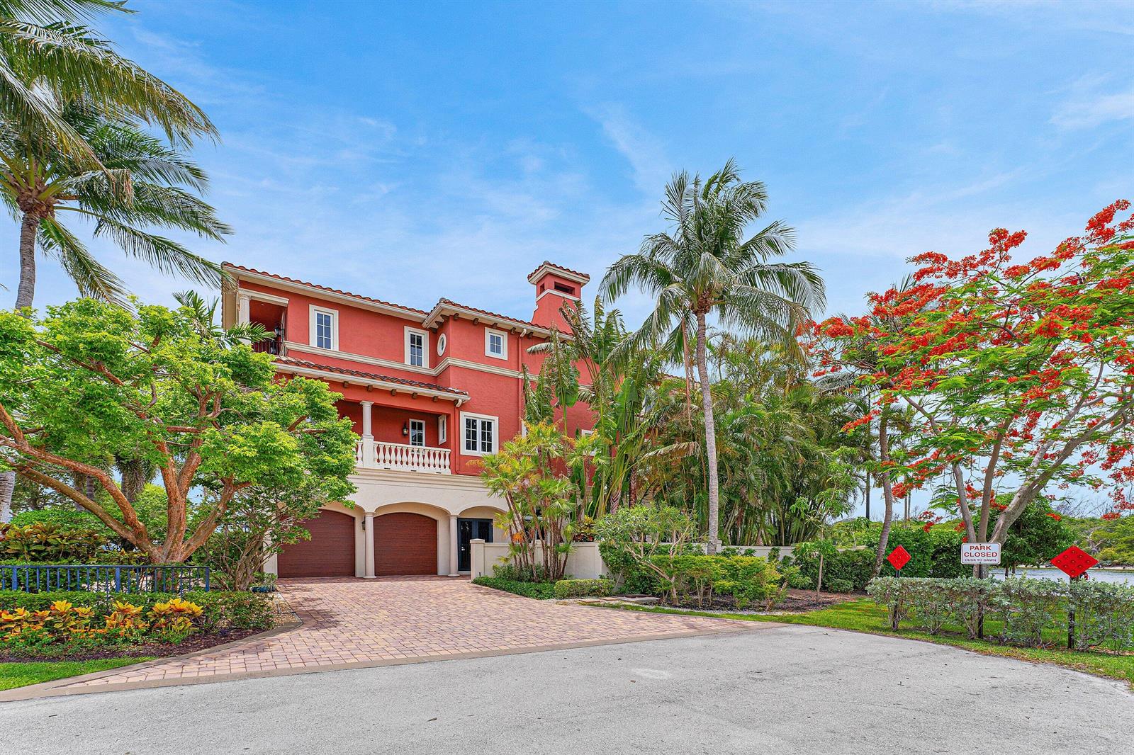 A three-story red stucco house with a paved driveway and palm trees in the yard — 453 NE 19th Avenue, Deerfield Beach FL 33441, DEERFIELD BEACH, FL