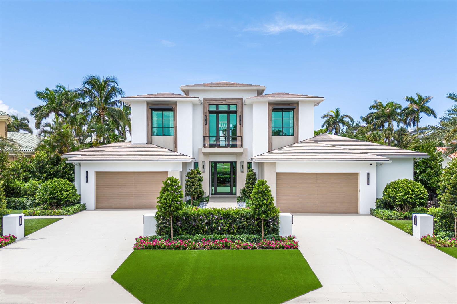 A two-story modern house with a symmetrical facade, two garages, and a landscaped front yard — 471 Royal Palm Way, Boca Raton FL 33432, BOCA RATON, FL