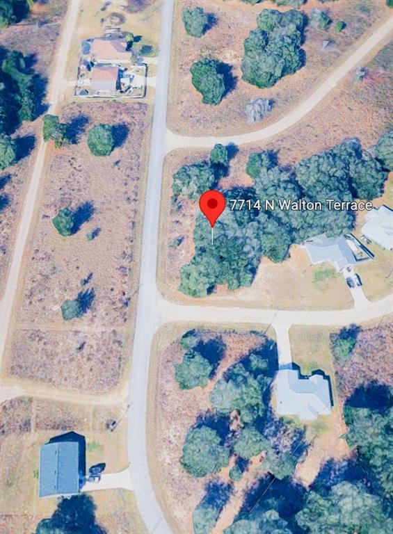 An aerial map view shows a wooded residential lot with a location pin — 7714 N WALTON TERRACE, DUNNELLON, FL