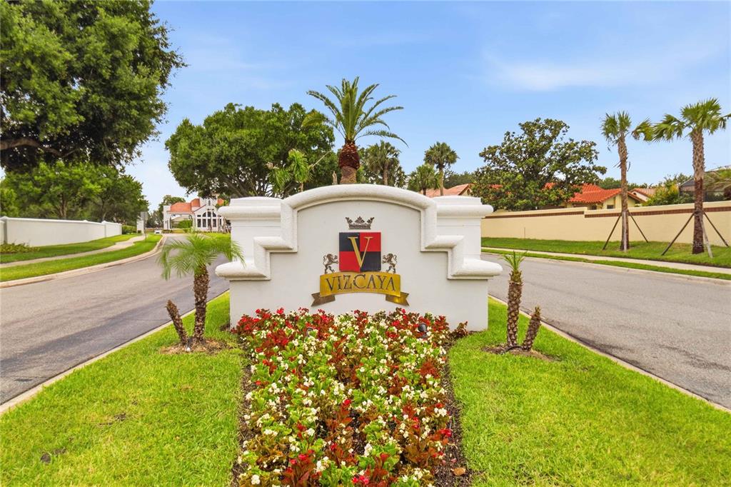 An aerial view shows a residential neighborhood situated along the shore of a large lake — 8310 TIVOLI DRIVE, ORLANDO, FL