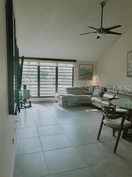 A living room with light tile floors, a sectional sofa, and a ceiling fan — 322 Beach Village BEACH VILLAGE - CANDELERO DRIVE - UNIT 322, HUMACAO, PR