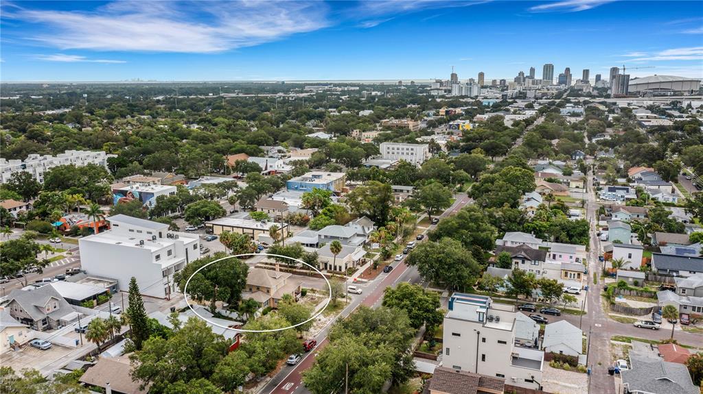 An aerial view shows a residential house circled in a neighborhood near a city skyline — 2701 1ST AVENUE S, ST PETERSBURG, FL