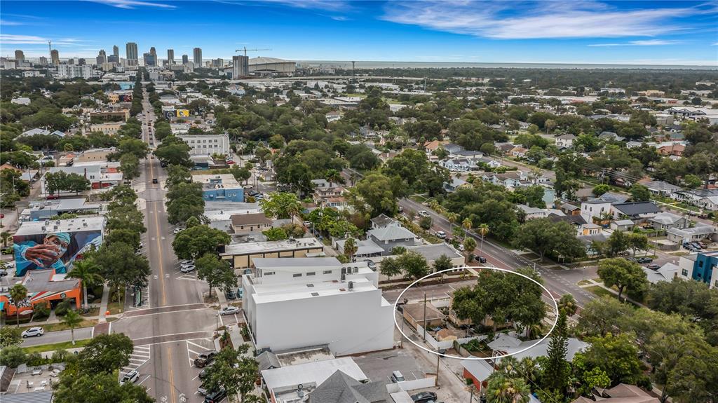 An aerial view shows a residential property circled in a neighborhood near a city skyline — 2701 1ST AVENUE S, ST PETERSBURG, FL