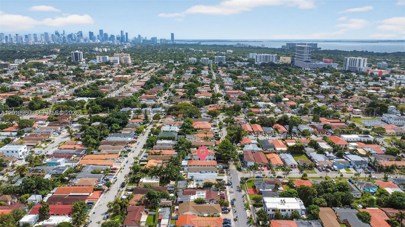 An aerial view shows a residential neighborhood with a pink pin marking a specific property — 3297 SW 26th St, Miami FL 33133, MIAMI, FL