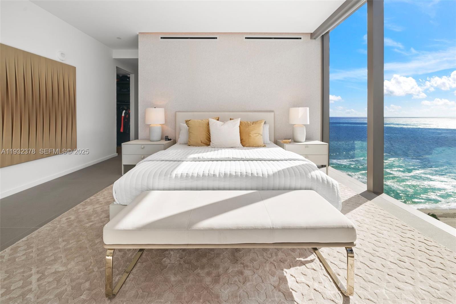 A modern bedroom features a bed facing floor-to-ceiling windows with an expansive ocean view — 2000 S Ocean Dr # 18B, Hallandale Beach FL 33009, HALLANDALE BEACH, FL