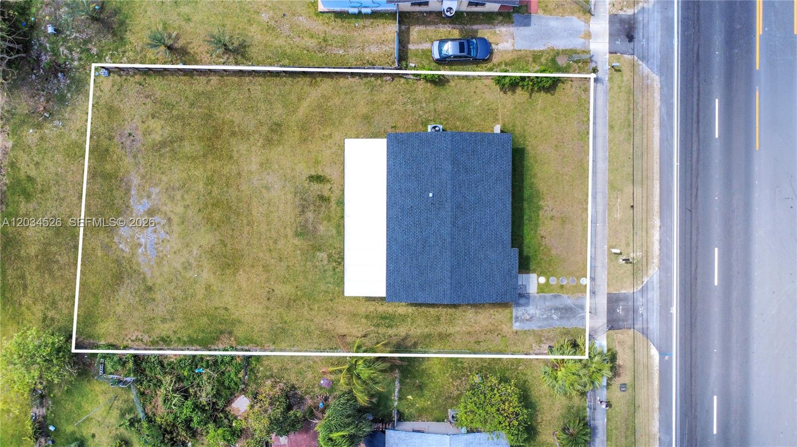 An aerial view shows a rectangular lot with a house and a large yard — 12840 SW 268th St, Homestead FL 33032, HOMESTEAD, FL