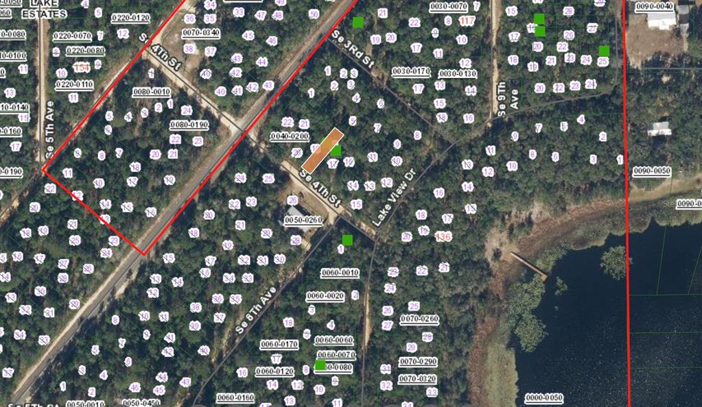 This is an aerial map showing a highlighted rectangular property lot located near a road — XX SE 4TH ST, INTERLACHEN, FL