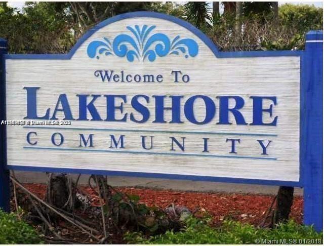 A blue and white sign welcomes visitors to the Lakeshore Community — 889 Hamilton Dr # 889I, Homestead FL 33034, HOMESTEAD, FL