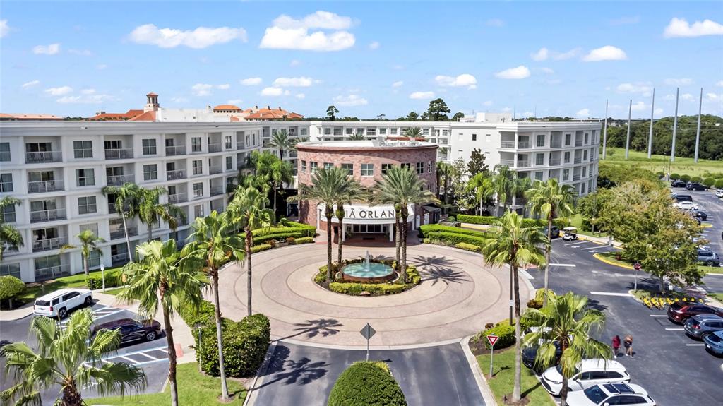 An aerial view shows a multi-story hotel with a circular driveway and central fountain — 225 CELEBRATION PLACE UNIT 427, CELEBRATION, FL