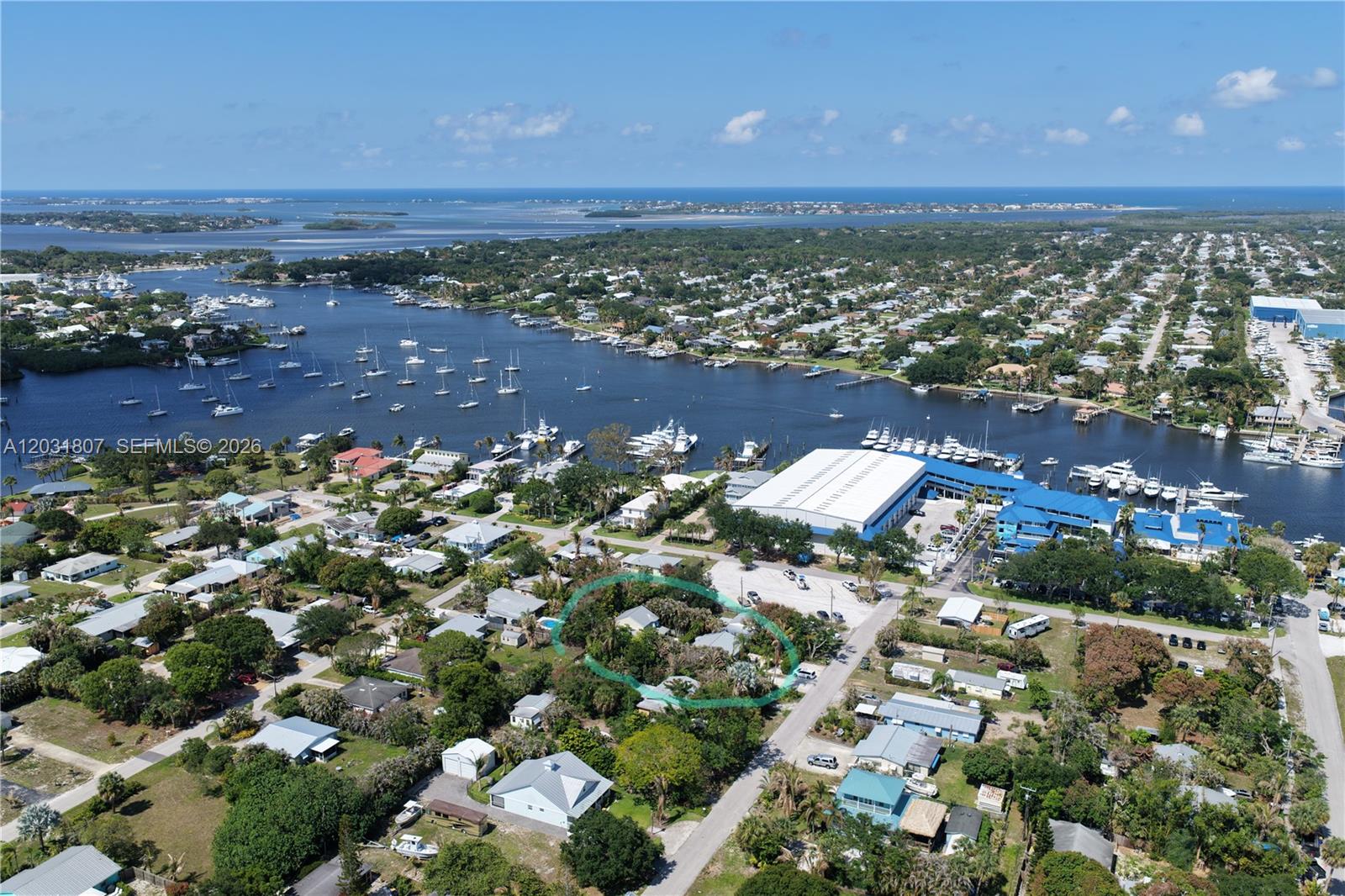 An aerial view shows a residential neighborhood with a circled house near a marina — 4225 SE Westfield St, Stuart FL 34997, STUART, FL